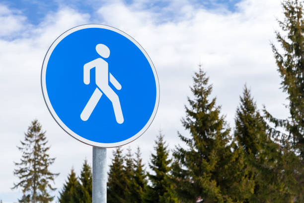 istock Pedestrians Path. Blue round road sign close up 1390878005