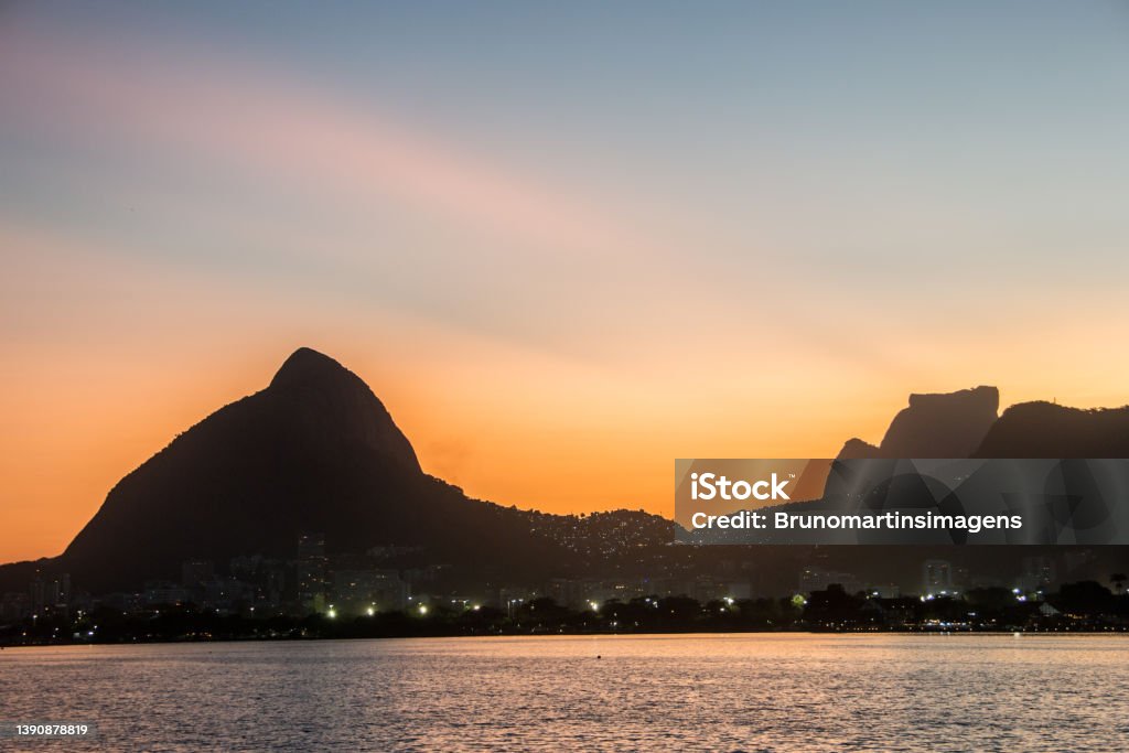 Sunset at Rodrigo de Freitas Lagoon in Rio de Janeiro. Sunset at Rodrigo de Freitas Lagoon in Rio de Janeiro, Brazil. Architecture Stock Photo