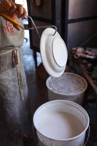 istock A Mature woman making pottery in her home studio. 1390879016
