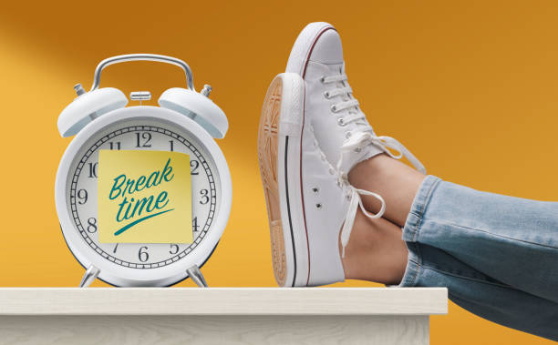 Woman with feet up on desk during break time