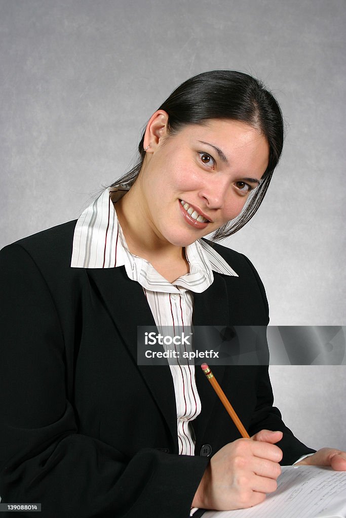 Young Professional Young professional woman taking notes. 20-29 Years Stock Photo