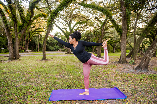 The start of my yoga journey coincided with the beginning of my life in the United States. I discovered yoga while waiting to start college as an international student for my bachelor’s degree in Photography. I began my first in person classes with a live yoga instructor on campus, experiencing fundamental yoga principles and postures with a trained yogi for the first time. As my strength and flexibility grew, I instinctively knew that I’d be doing yoga for the rest of my life and practicing would keep me calm and centered during turbulent times. My instincts turned out to be spot on. In my junior year of college, my mother got diagnosed with breast cancer and my world turned upside down. As the economy crashed along with my mom’s health during the Recession, I leaned on my yoga practices even more. Yoga kept me centered and focused as I navigated through financial challenges, graduating Magna Cum Laude, producing a photo exhibition and supporting my mom through her health crisis.

I have continued to use yoga as a core self-care practice for my mental and physical health and strength, especially during trying times. There have been many periods when I have stopped due to life’s twists and turns, but I always come back to my need to use the breath and asanas to reconnect me to stillness and calm. Practicing yoga in a more deep and meaningful way has not always been easy. Doing yoga in a studio has sometimes been cost prohibitive, but I find creative ways to get the deep connection of practicing with people; despite usually being the only black woman in the room. I have been wanting the opportunity to deepen my practice for many years with yoga teacher training. The pandemic turned out to be a blessing in disguise; I was blessed with scholarship to pursue a 200-hour Yoga Teacher training from My Vinyasa Practice. Now as a certified instructor, I not only get to deepen my understanding of yoga philosophy and incorporate it into my life, but also share it with others.