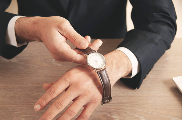 istock business man hand watch 1390881587