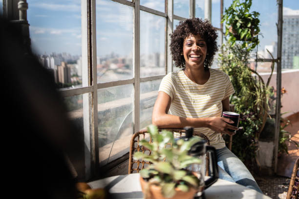 istock Young woman having breakfast with someone at home 1390883198