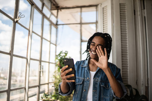 istock Young man on a video call on the mobile phone at home 1390884034