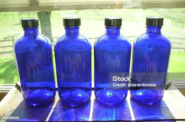 Vier Blue Flaschen Stockfoto und mehr Bilder von Alternative Medizin - Alternative Medizin, Blau, Creme