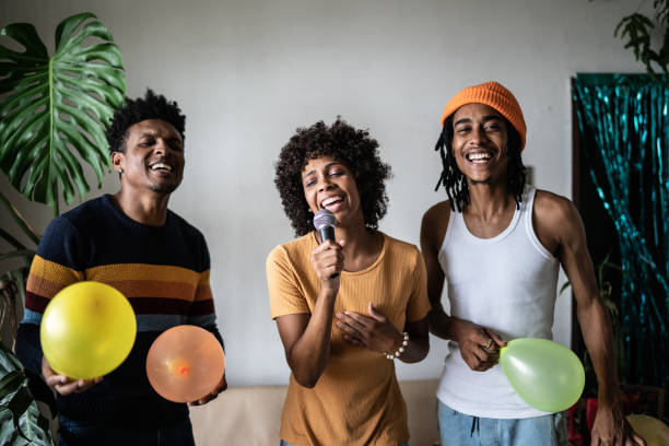 istock Friends singing together at home 1390885608