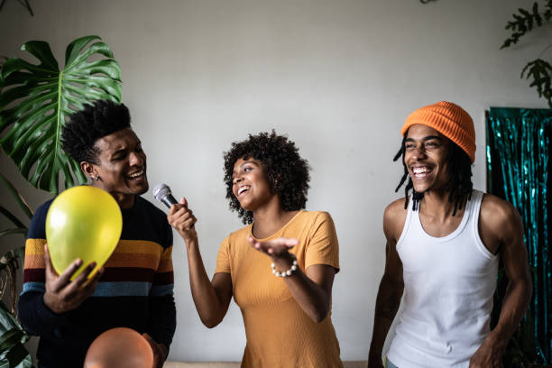 istock Friends singing together at home 1390885609