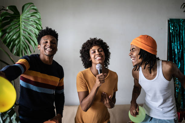 istock Friends singing together at home 1390885613