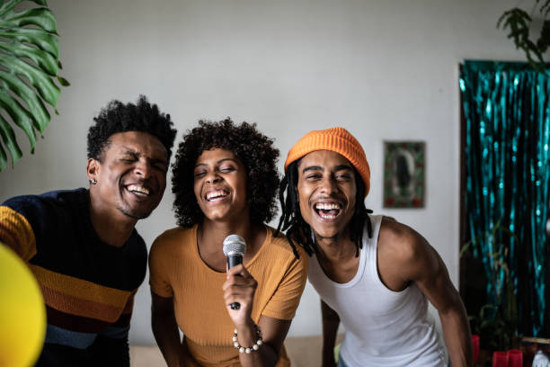 istock Friends singing together at home 1390885621