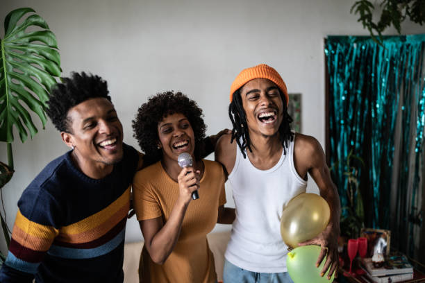 istock Friends singing together at home 1390885625