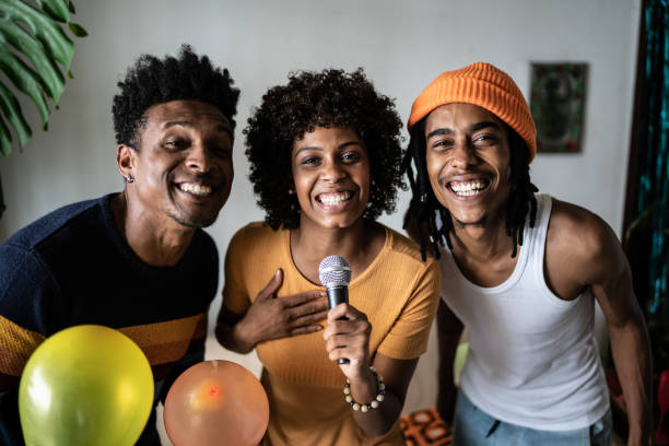 istock Friends singing together at home 1390885627