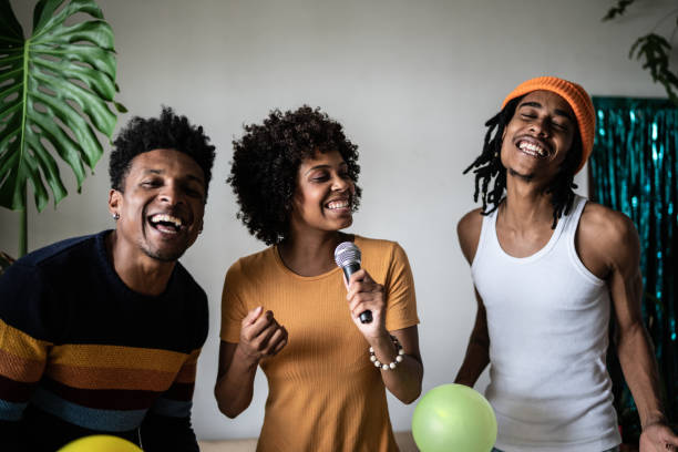 istock Friends singing together at home 1390885629