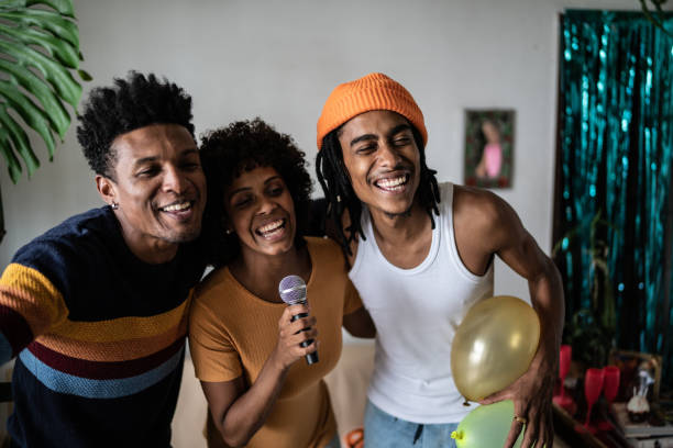 istock Friends singing together at home 1390885630