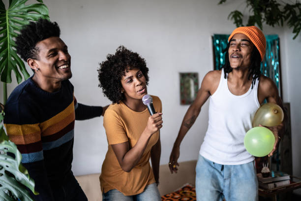 istock Friends singing together at home 1390885638
