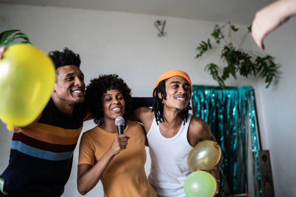 istock Friends singing together at home 1390885641