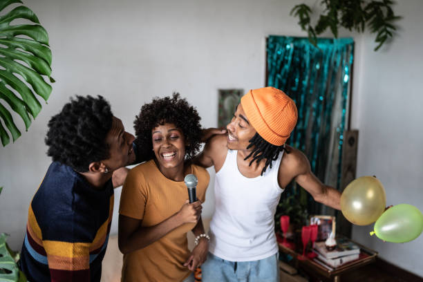 istock Friends singing together at home 1390885646