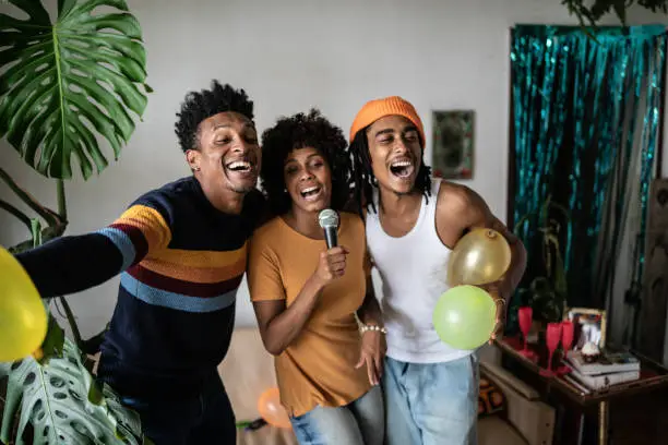 Photo of Friends singing together at home