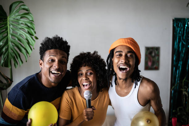 istock Friends singing together at home 1390885655