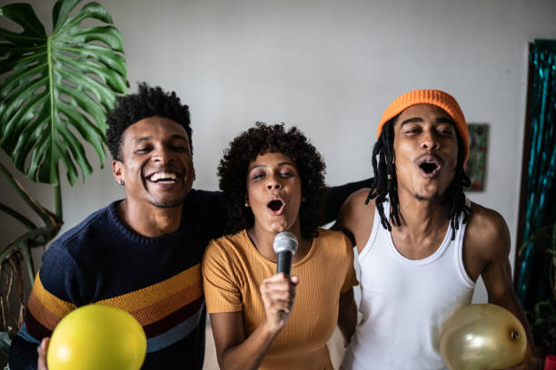 istock Friends singing together at home 1390885658