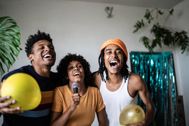 istock Friends singing together at home 1390885659