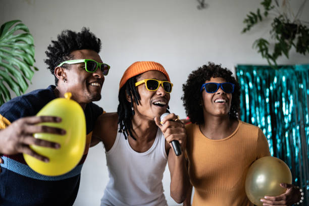 istock Friends singing together at home 1390885678