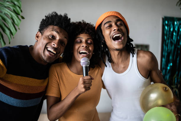 istock Friends singing together at home 1390885703
