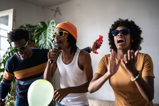 istock Friends singing together at home 1390885717