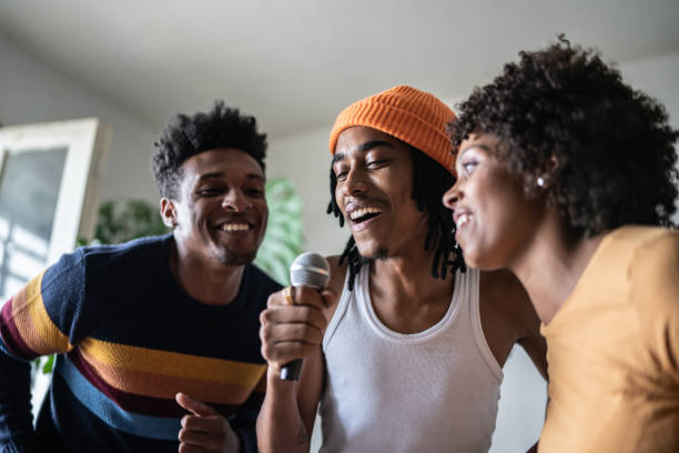 istock Friends singing together at home 1390885725