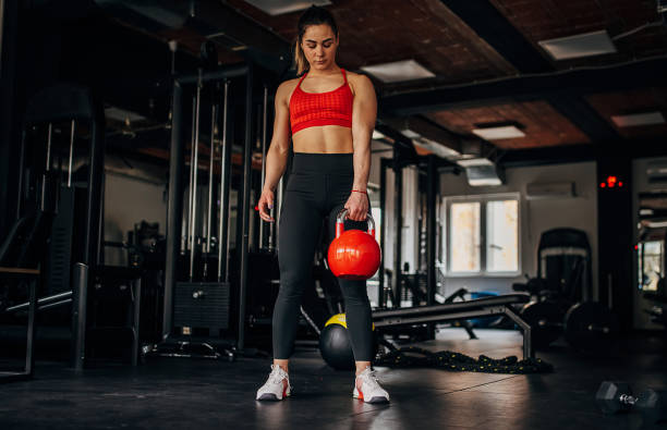 istock Fit woman training with kettlebell 1390886638