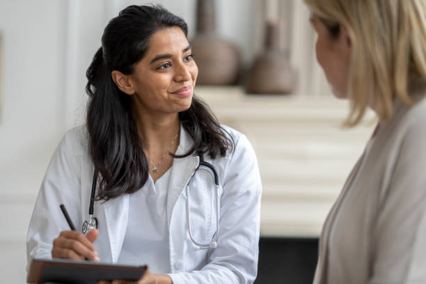 istock Homecare Visit with a Senior Woman 1390886672