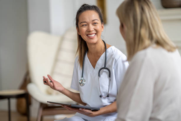 istock Homecare Visit with a Senior Woman 1390886679