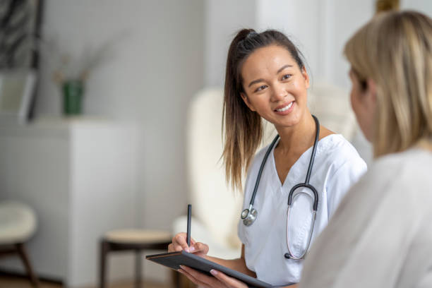 istock Homecare Visit with a Senior Woman 1390886680