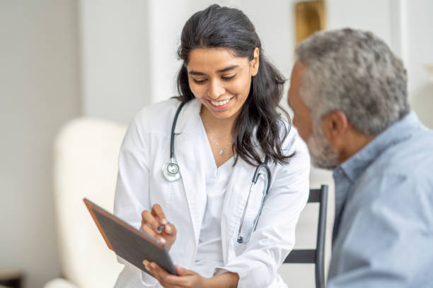 istock Homecare Visit with a Senior Gentleman 1390886689