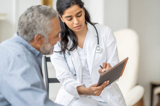 istock Homecare Visit with a Senior Gentleman 1390886693