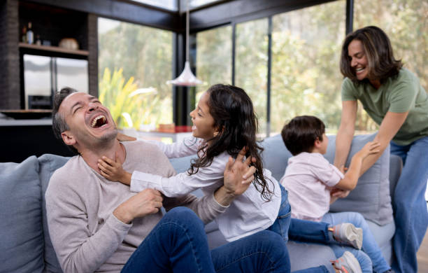 istock Happy family having fun at home 1390886894