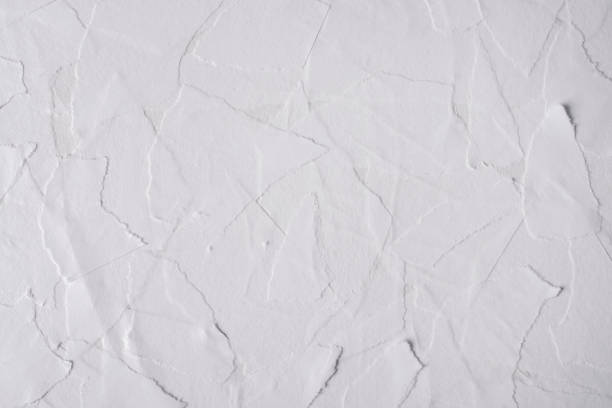 istock Pieces of torn paper pasted on the wall. 1390888115
