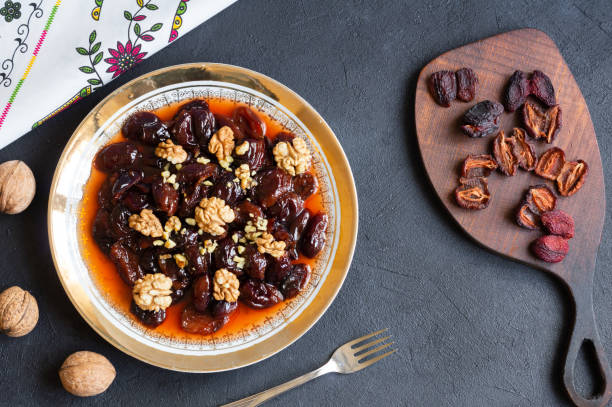 istock Homemade dried plum dessert with walnuts, traditional dessert with syrup 1390891933