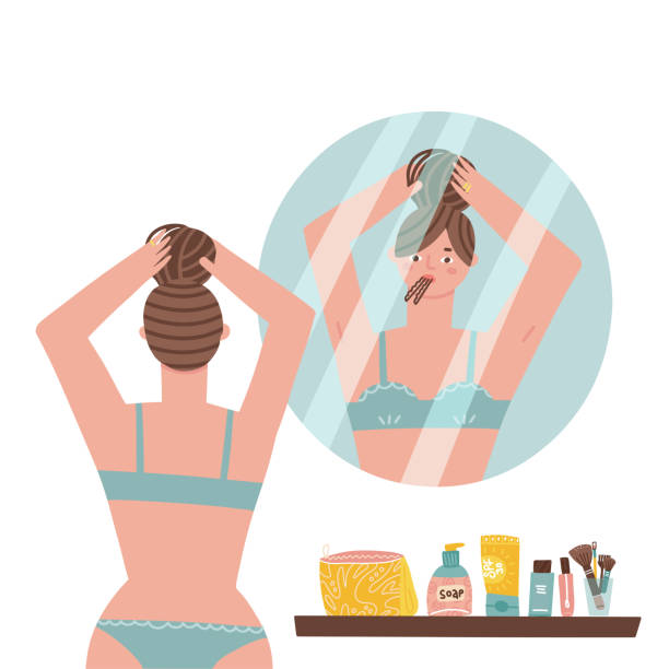 ilustrações de stock, clip art, desenhos animados e ícones de daily morning routine. cute girl standing in front of bathroom mirror and putting her hair in a bun. woman making hairstyle. beauty care. young lady looking at her reflection. flat vector illustration - hair bun hairstyle beautiful looking