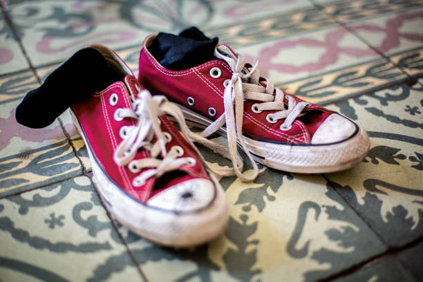 istock Dirty sneakers and socks after coming from school 1390896980