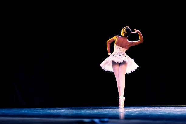istock Black girl dancing Raymonda ballet on stage 1390898195