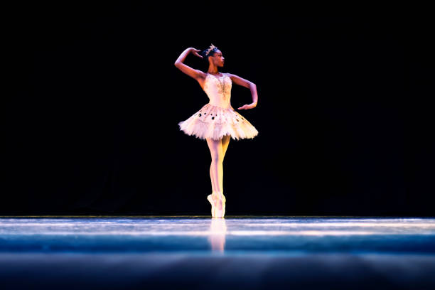 Black girl dancing Raymonda ballet on stage Black girl dancing Raymonda ballet on stage ballerina stock pictures, royalty-free photos & images