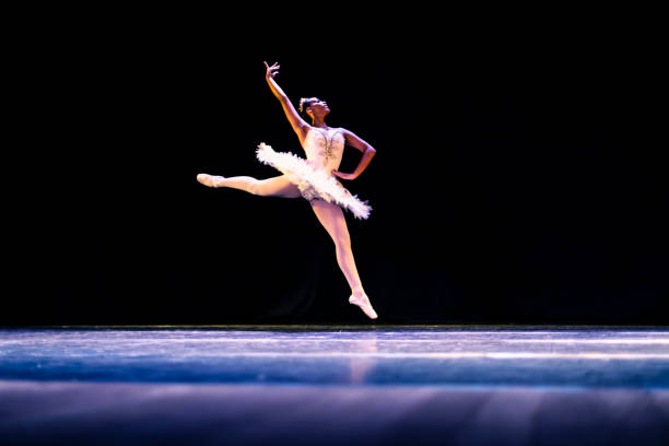 istock Black girl dancing Raymonda ballet on stage 1390898201