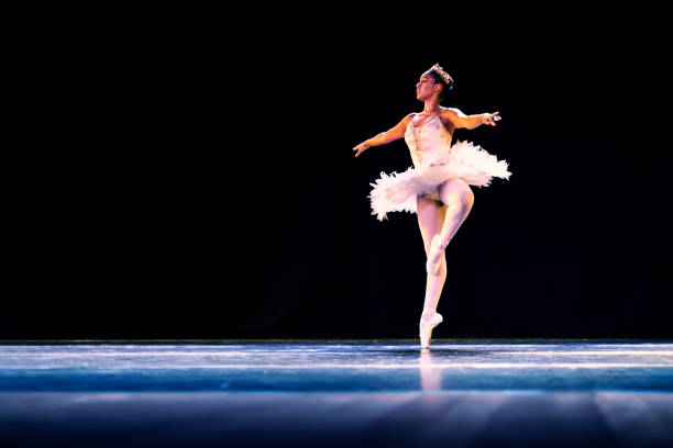 istock Black girl dancing Raymonda ballet on stage 1390898241