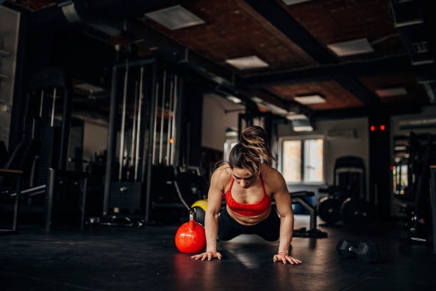 istock Fit woman exercising in gym 1390898857