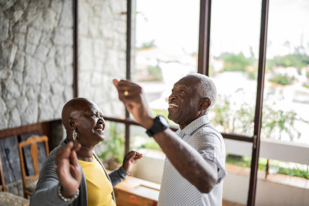 istock Happy senior couple dancing at home 1390899585