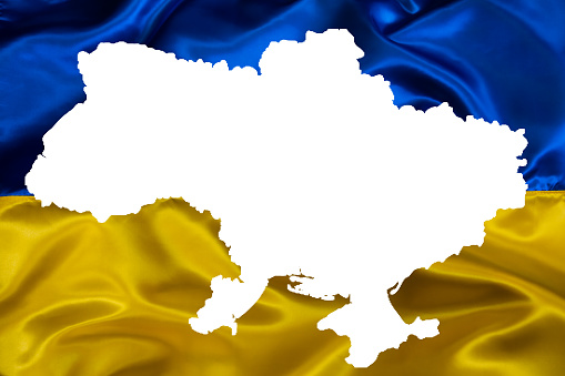 Outline Map of Ukraine on waving Ukrainian national flag background for design purpose