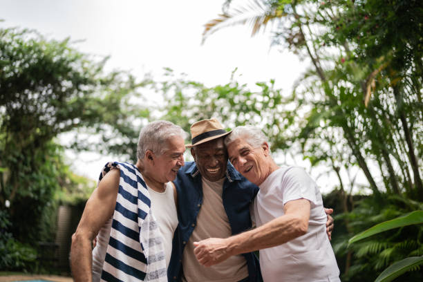 istock Senior men embracing on a pool party 1390899949
