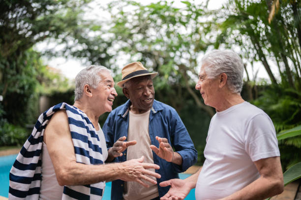 istock Senior men having fun on a pool party 1390899970