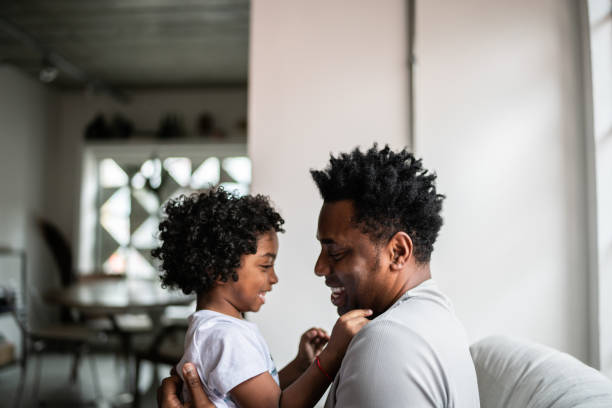 istock Bonding moment between father and son at home 1390901130